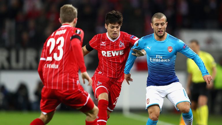 Cologne's Jorge Mere and Arsenal midfielder Jack Wilshere battle for possession