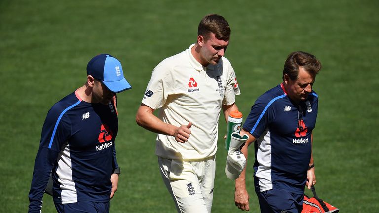 ADELAIDE, AUSTRALIA - NOVEMBER 09:  Jake Ball of England walks from the field after falling and injuring himself whilst bowling during day two of the Four 