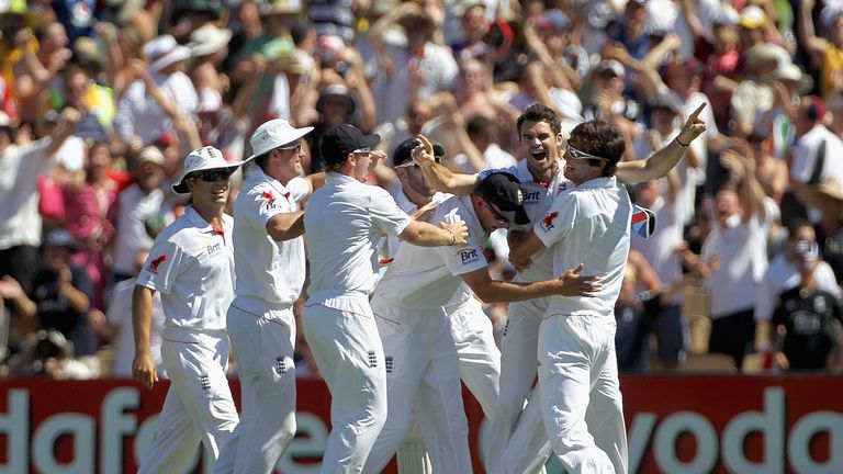 James Anderson (2nd R) of England celebrates with team mates after taking the wicket of Ricky Ponting of Australia