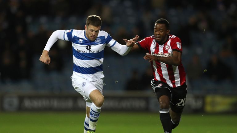 Queens Park Rangers forward Jamie Mackie (left) and Brentford's Josh Clarke battle for the ball