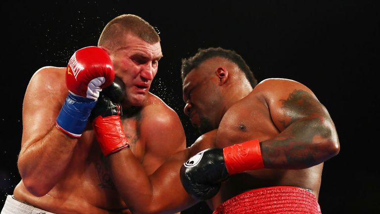 Jarrell Miller punches Mariusz Wach during their Heavyweight  bout at Nassau Veterans Memorial Coliseum on November 11, 2017 