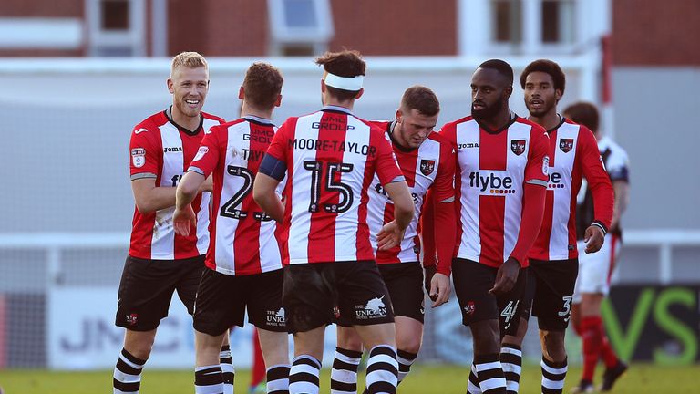 Jayden Stockley and Exeter City celebrate a first-round victory