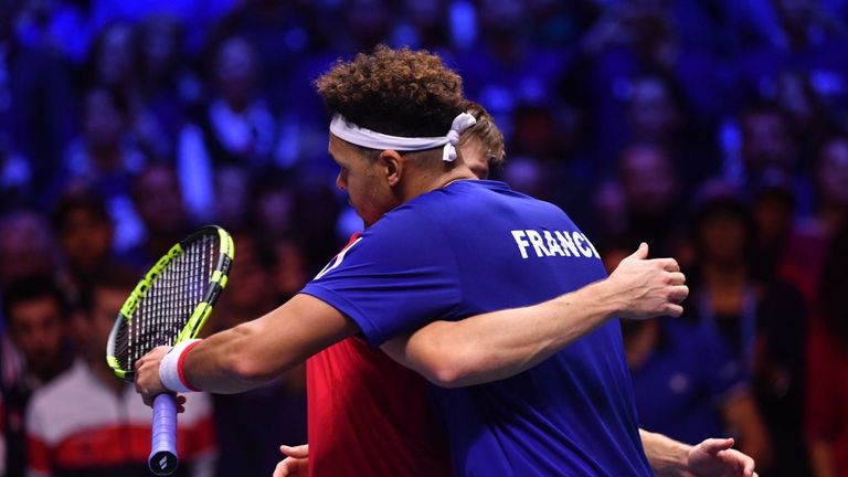 France's Jo-Wilfried Tsonga (L) hugs Belgium's David Goffin after losing their singles rubber 4 of the 2017 Davis Cup final in Lille.