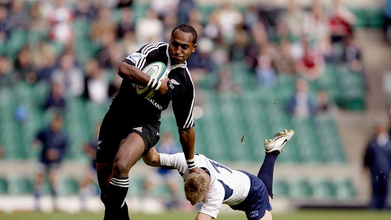 TWICKENHAM - JUNE 04 2005:  Joe Rokocoko of New Zealand brushes aside the tackle from Andrew Turnbull of Scotland during the IRB London 7's Tour