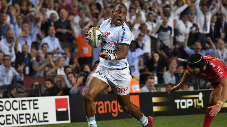 Racing Metro 92's New Zealander wing Joe Rokocoko (C) runs to score his try during the French Top14 rugby union final match Toulon vs Racing 92 at the Camp