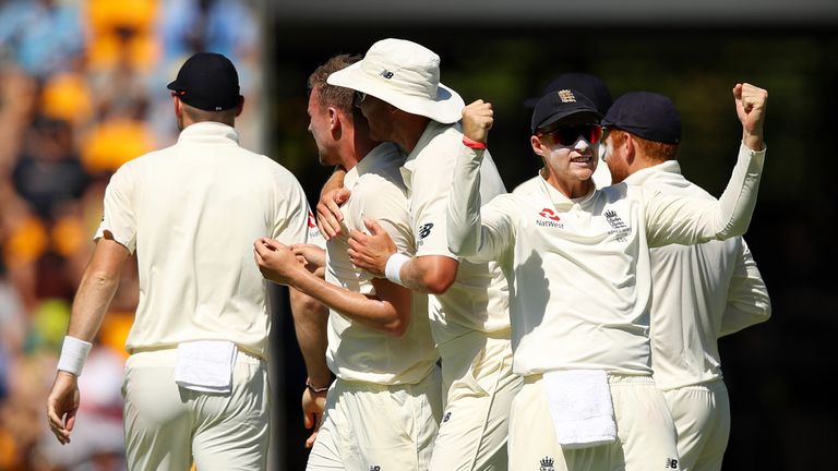 Joe Root of England celebrates after team mate Jake Ball of England dismisses David Warner of Australia during day two o