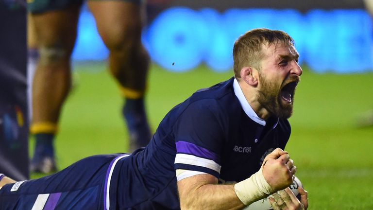 Scotland's flanker John Barclay celebrates scoring a try  against Australia