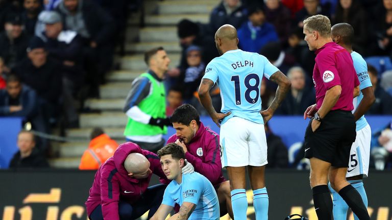 John Stones of Manchester City receives medical treatment against Leicester City
