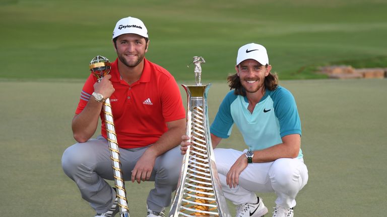 DUBAI, UNITED ARAB EMIRATES - NOVEMBER 19:  Jon Rahm of Spain poses with the trophy and Tommy Fleetwood of England poses with the Race to Dubai trophy duri