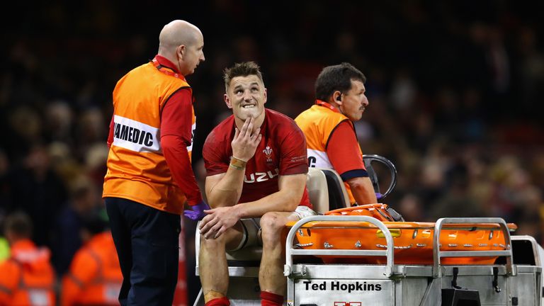 CARDIFF, WALES - NOVEMBER 11: Jonathan Davies of Wales reacts to being stretchered off with a injury after during the Under Armour Series match between Wal