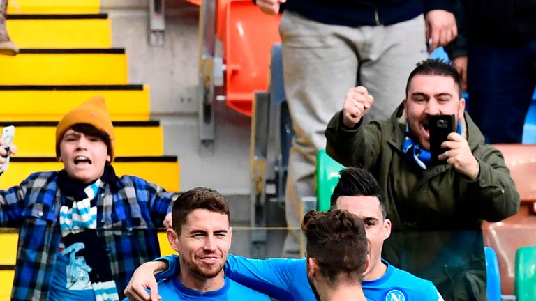 Napoli's Brazilian midfielder Jorginho celebrates with teammates Napoli's forward from Belgium Dries Mertens and Napoli's midfielder from Spain Jose Maria 