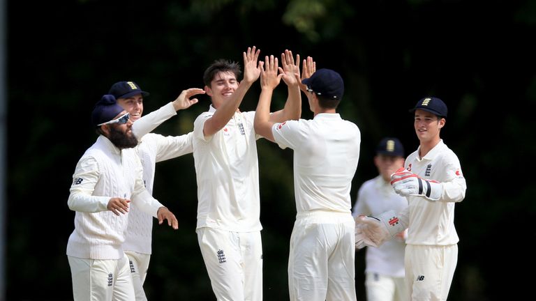 CHESTERFIELD, ENGLAND - JULY 23:  Josh Tongue (2 L) of England celebrates with his team-mates after he takes the wicket of Himanshu Rana of India during th