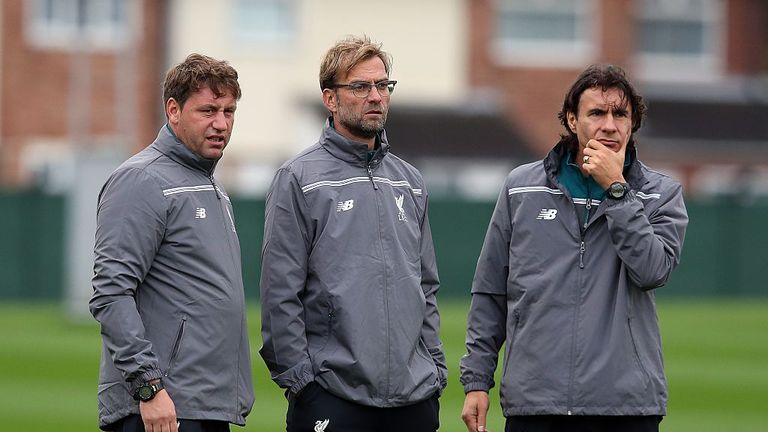LIVERPOOL, MELWOOD - OCTOBER 21: Liverpool manager Jurgen Klopp (C) looks on next to his assistants Peter Krawietz (L)  and Zeljko Buvac during training.