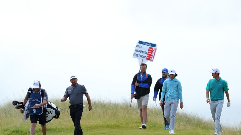 LONDONDERRY, NORTHERN IRELAND - JULY 07:  Justin Rose of England, Tommy Fleetwood of England and Graeme McDowell of Northern Ireland walk down the 8th hole