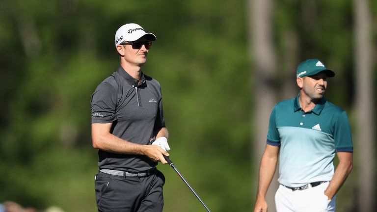 AUGUSTA, GA - APRIL 09: (L-R) Justin Rose of England watches his tee shot on the 12th hole as Sergio Garcia of Spain looks on during the final round of the