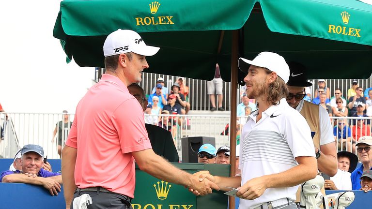 DUBAI, UNITED ARAB EMIRATES - NOVEMBER 16:  Justin Rose of England shakes hands with Tommy Fleetwood of England (R) on the 1st tee during the first round o
