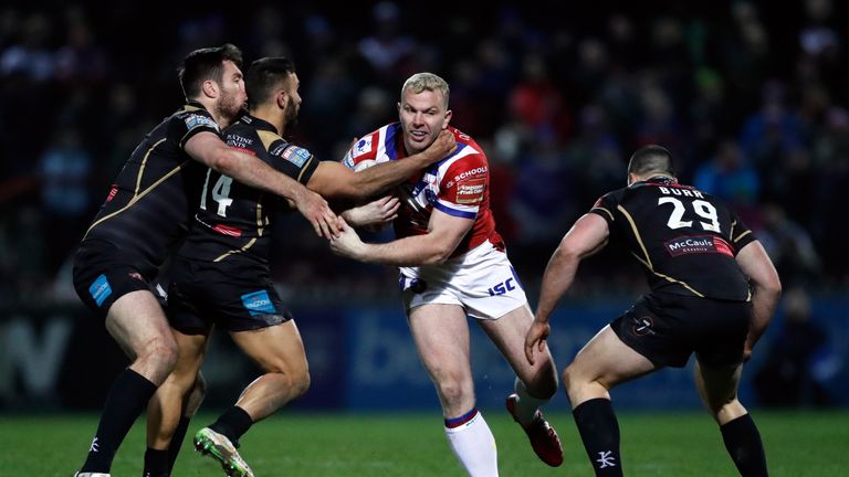Wakefield's Keegan Hirst is tackled by and Leigh Centurions' Lachlan Burr (right) and Eloi Pelissier (second left) during the Betfred Super League match