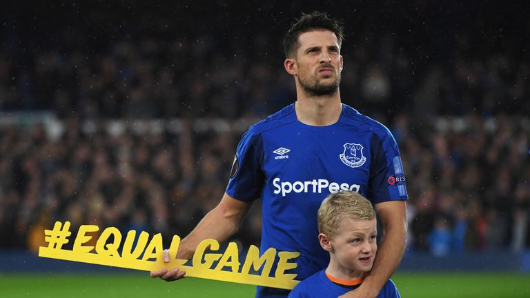 LIVERPOOL, ENGLAND - OCTOBER 19:  Kevin Mirallas of Everton holds the #equalgame banner prior to the UEFA Europa League Group E match between Everton FC an