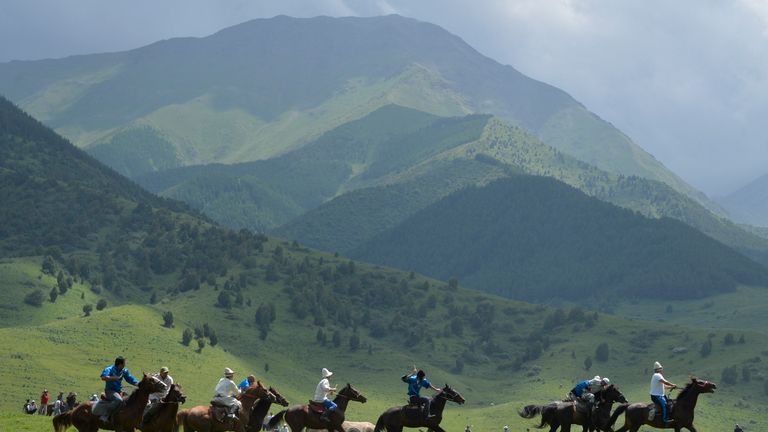 Mounted Kyrgyz riders play the traditional central Asian sport Kok-boru