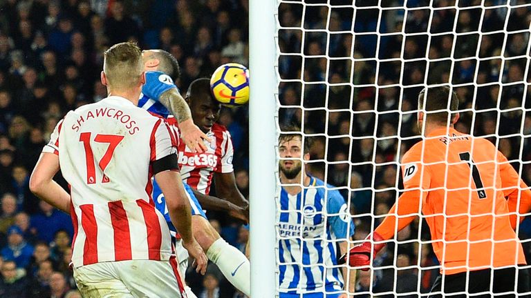 Stoke City's French defender Kurt Zouma heads the ball to score their second goal for 1-2 during the English Premier League football match between Brighton
