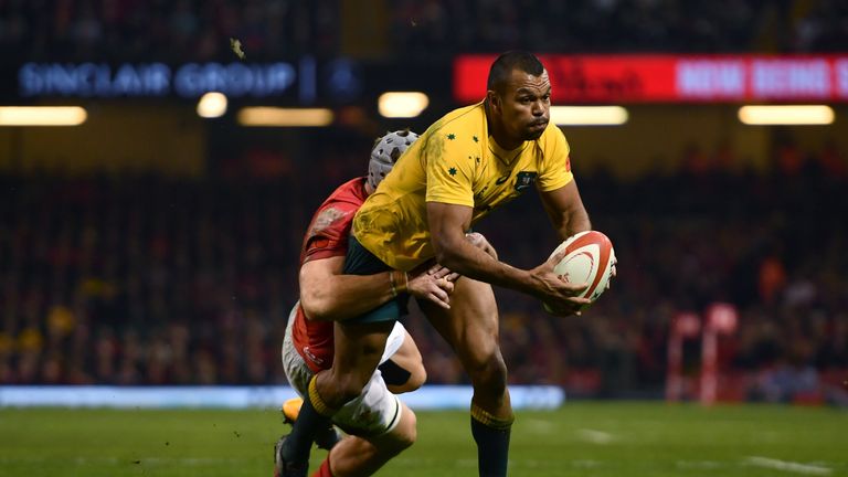 CARDIFF, WALES - NOVEMBER 11: Kurtley Beale of Australia breaks away from a tackle during the Under Armour Series match between Wales and Australia at Prin