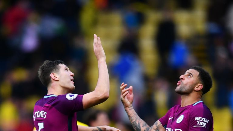 WATFORD, ENGLAND - SEPTEMBER 16:  John Stones of Manchester City and Kyle Walker of Manchester City celebrate victory after the Premier League match betwee