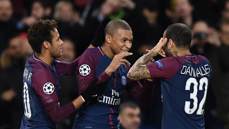 Paris Saint-Germain's Kylian Mbappe (centre) celebrates with Neymar (L) and Dani Alves (R) after scoring against Celtic