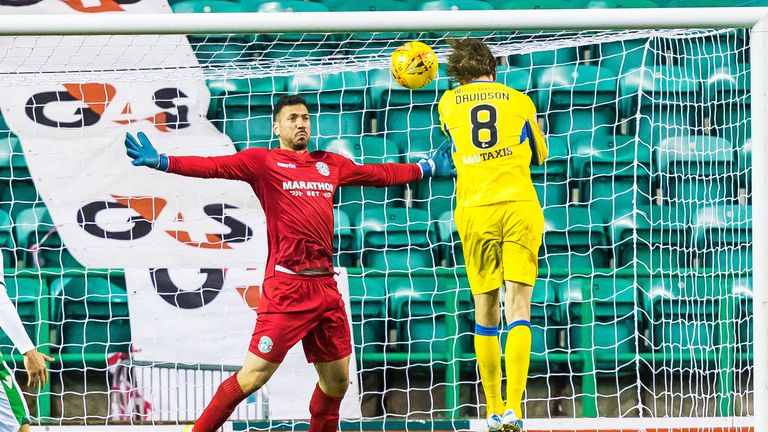 St Johnstone's Murray Davidson heads in to make it 1-0