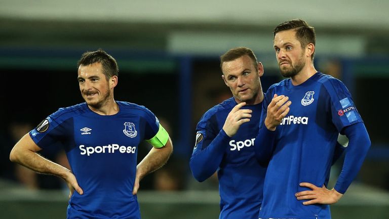 Leighton Baines (L) looks on as Wayne Rooney (C) and Gylfi Sigurdsson discuss a free-kick in Europa League group E match against Apollon Limassol on Sep 28