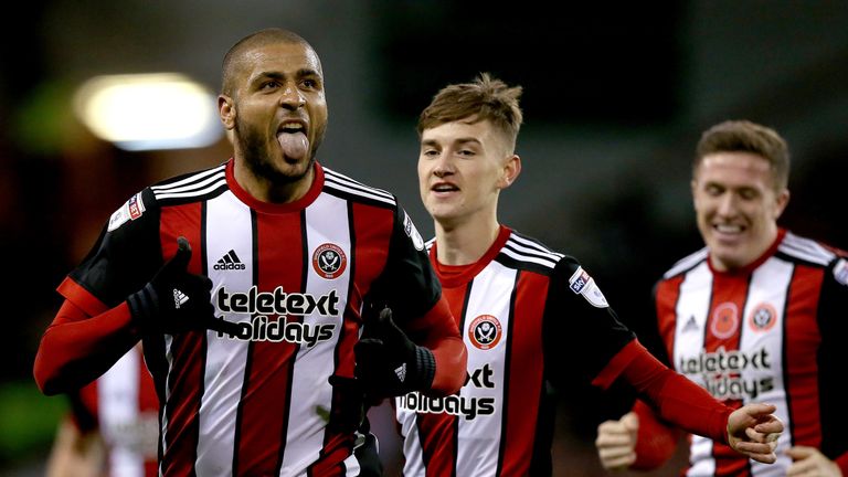 Leon Clarke celebrates scoring his fourth goal