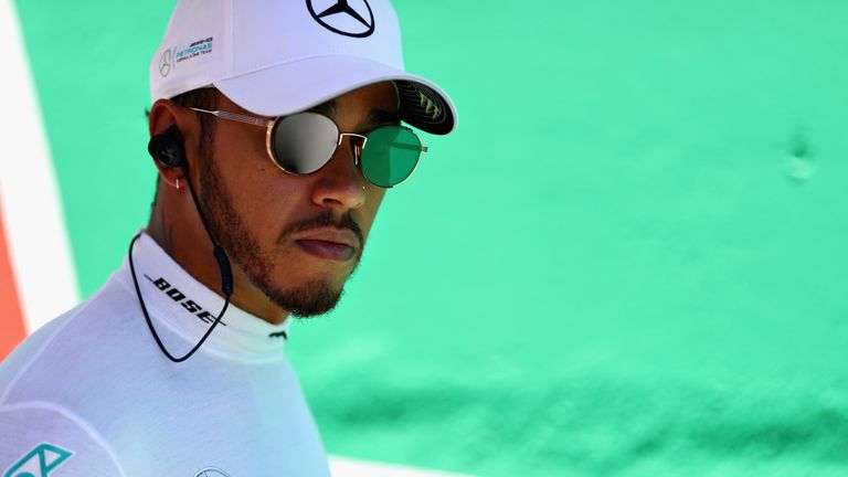 SAO PAULO, BRAZIL - NOVEMBER 12: Lewis Hamilton of Great Britain and Mercedes GP looks on on the grid before the Formula One Grand Prix of Brazil at Autodr