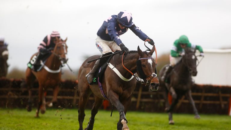 Tom O' Brien and London Prize clear the last flight before going on to win The Unibet Elite Hurdle Race run during Badger Chase Day at Wincanton Racecourse