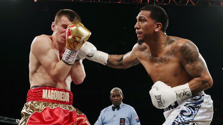 LAS VEGAS, NV - JUNE 17:  Luis Arias (R) connects with a right to Arif Magomedov during their middleweight bout at the Mandalay Bay Event Center on June 17