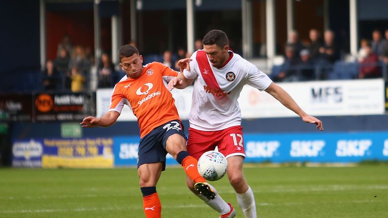 LUTON, ENGLAND - SEPTEMBER 30: Luke Gambin of Luton Town and Ben Tozer of Newport County battle for possession during the Sky Bet League Two match between 
