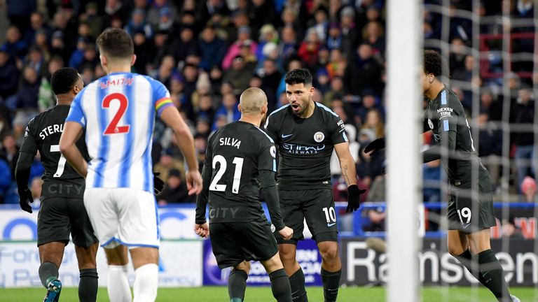 HUDDERSFIELD, ENGLAND - NOVEMBER 26:  Sergio Aguero of Manchester City celebrates scoring the first Manchester City goal with David Silva, Leroy Sane and R