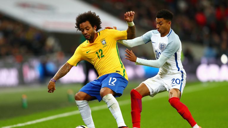 LONDON, ENGLAND - NOVEMBER 14: Marcelo of Brazil and Jessie Lingard of England during the international friendly match between England and Brazil at Wemble