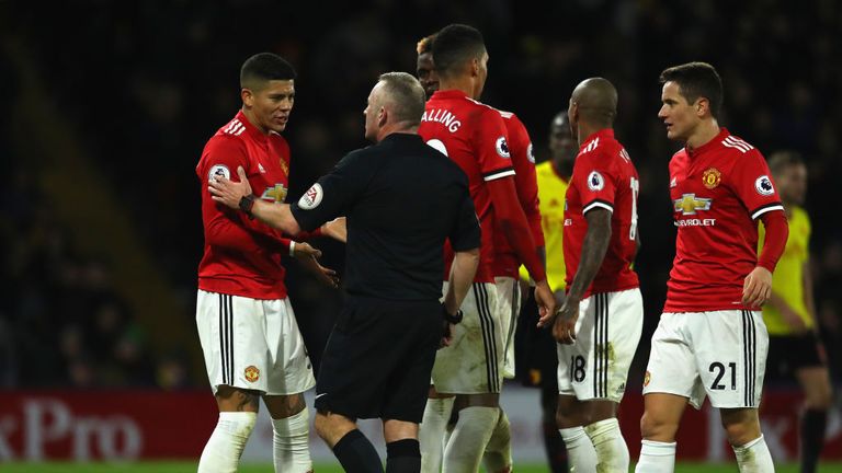 WATFORD, ENGLAND - NOVEMBER 28:  Marcos Rojo of Manchester United in discussion with referee Jonathan Moss during the Premier League match between Watford 
