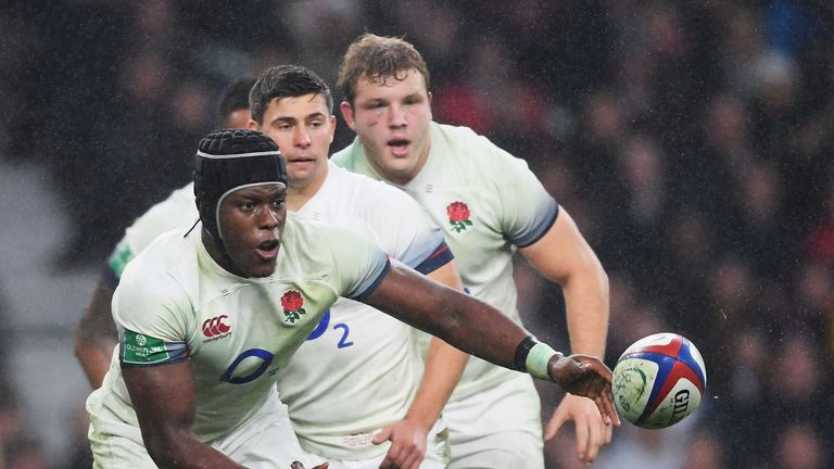 Maro Itoje looks to pass the ball for England