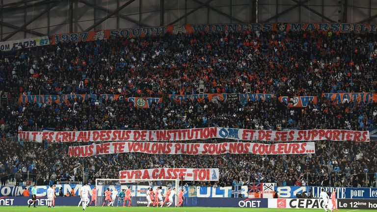 Olympique de Marseille fans hold a banner reading "You thought you were above the institution OM and its supporters. We don't want you wearing our colours.