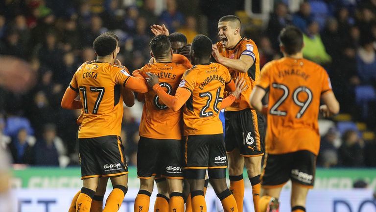 Conor Coady celebrates with Matt Doherty (obscured) as he celebrates scoring Wolves' second goal