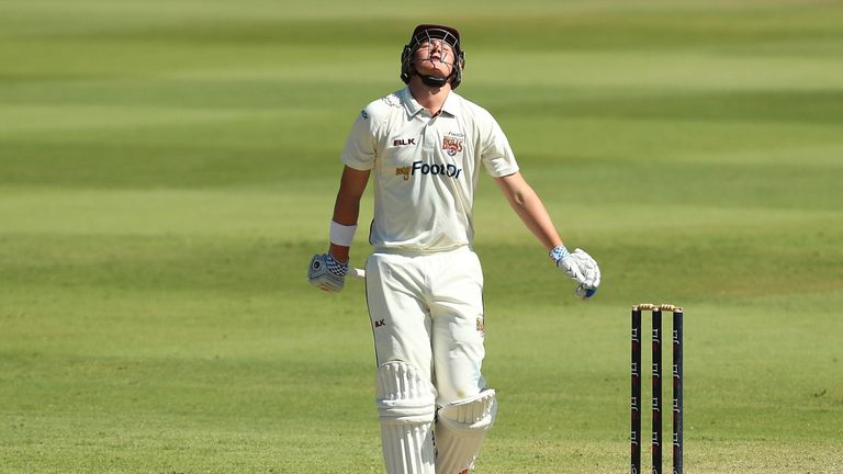 Matthew Renshaw of Queensland leaves the field after being dismissed by Doug Bollinger of New South Wales