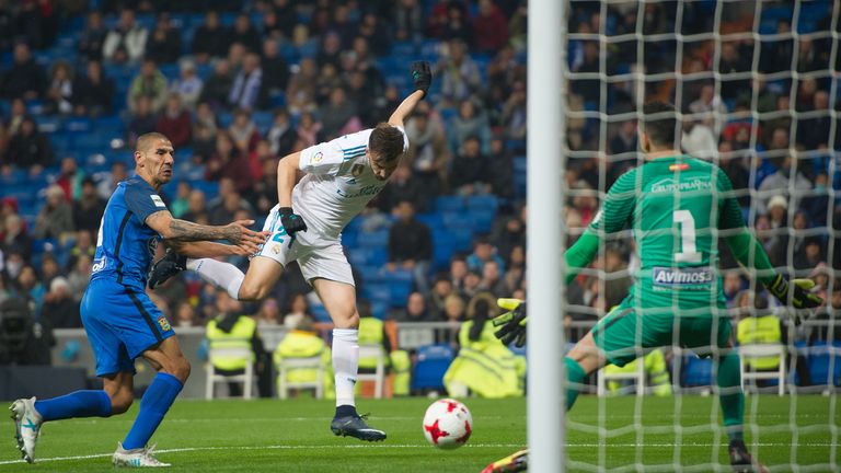 MADRID, SPAIN - NOVEMBER 28: Borja Mayoral of Real Madrid CF beats Pol of Fuenlabrada to score his team's opening goal during the Copa del Rey, Round of 32