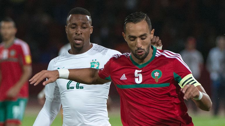 Morocco's defender and captain Mehdi Benatia (R) vies for the ball with Ivory Coast's forward Jonathan Kodjia during the World Cup 2018 qualifier football 