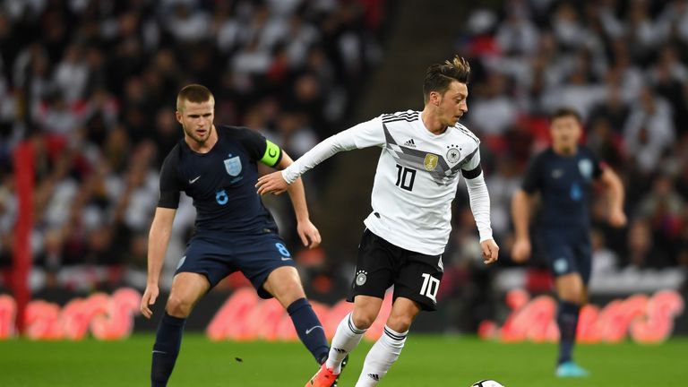 LONDON, ENGLAND - NOVEMBER 10: Mesut Oezil of Germany is put under pressure by Eric Dier of England during the International friendly match between England