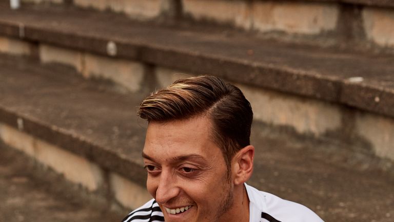 Mesut Ozil wears Germany's World Cup home shirt