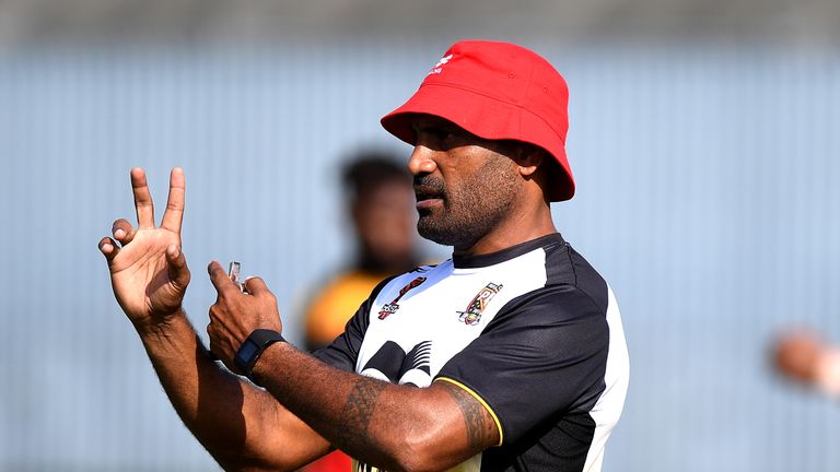 Kumuls coach Michael Marum talks tactics with his players ahead of Sunday's clash with England