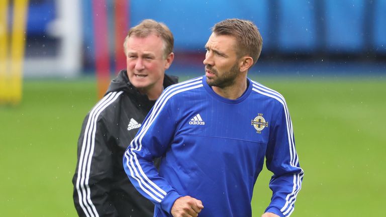 Gareth McAuley feels Michael O'Neill could make the switch to club management with ease should he make the move
