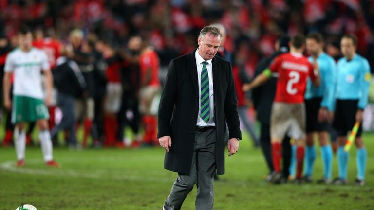 Michael O'Neill, manager of Northern Ireland looks dejected 