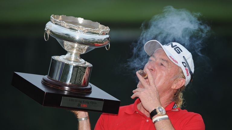 HONG KONG - NOVEMBER 18:  Miguel Angel Jimenez of Spain with the winners trophy and his cigar after the final round of the UBS Hong Kong open at The Hong K
