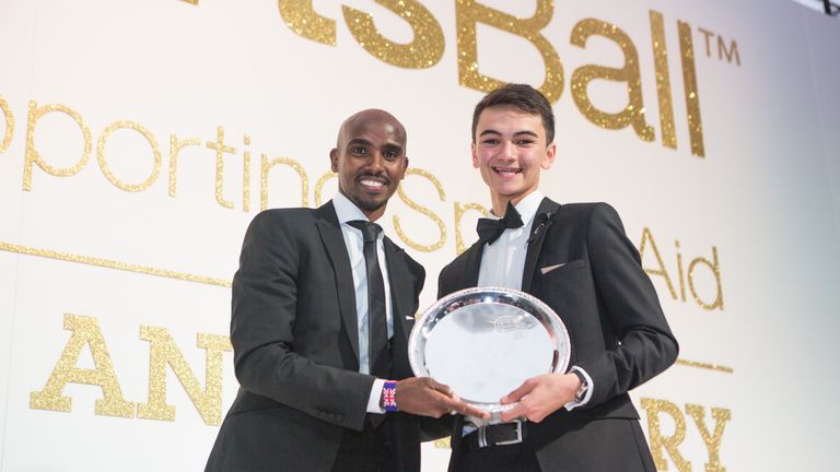 Double Olympic champion Sir Mo Farah presents triathlete Alex Yee with the One-to-Watch Award at the SportsAid SportsBall 2016